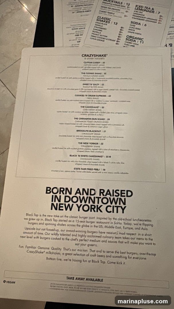 A menu from Black Tap featuring CrazyShakes, Classic Shakes, and other desserts. The menu also includes a description of the restaurant's philosophy and offerings.