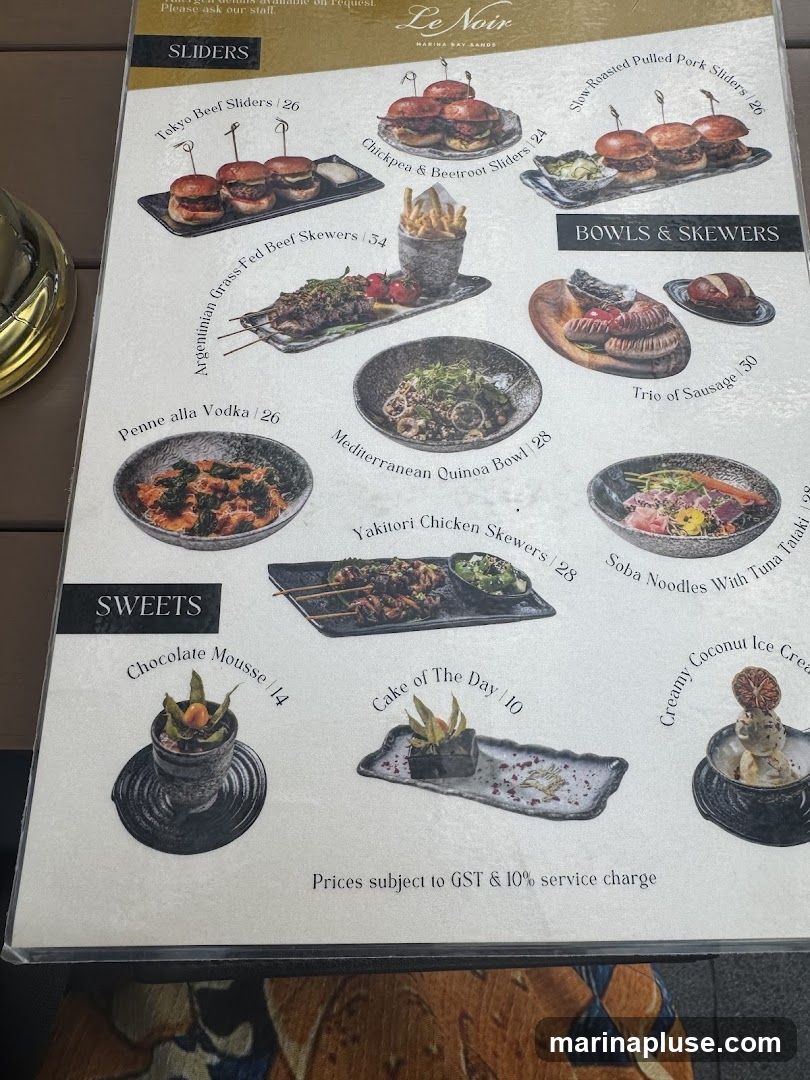 A menu from Le Noir with sections for Sliders, Bowls & Skewers, and Sweets.