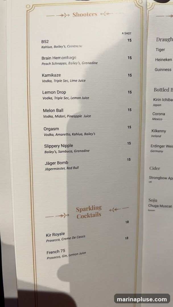A menu featuring shooters and sparkling cocktails.