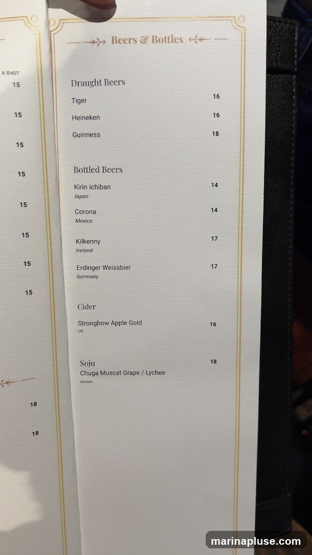 A menu listing various beers, ciders, and soju with their prices.