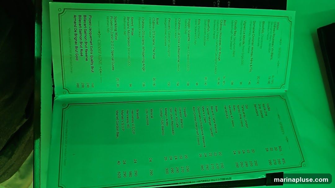 A menu featuring wines, champagnes, and spirits with prices listed per glass (GL) and bottle (BTL).