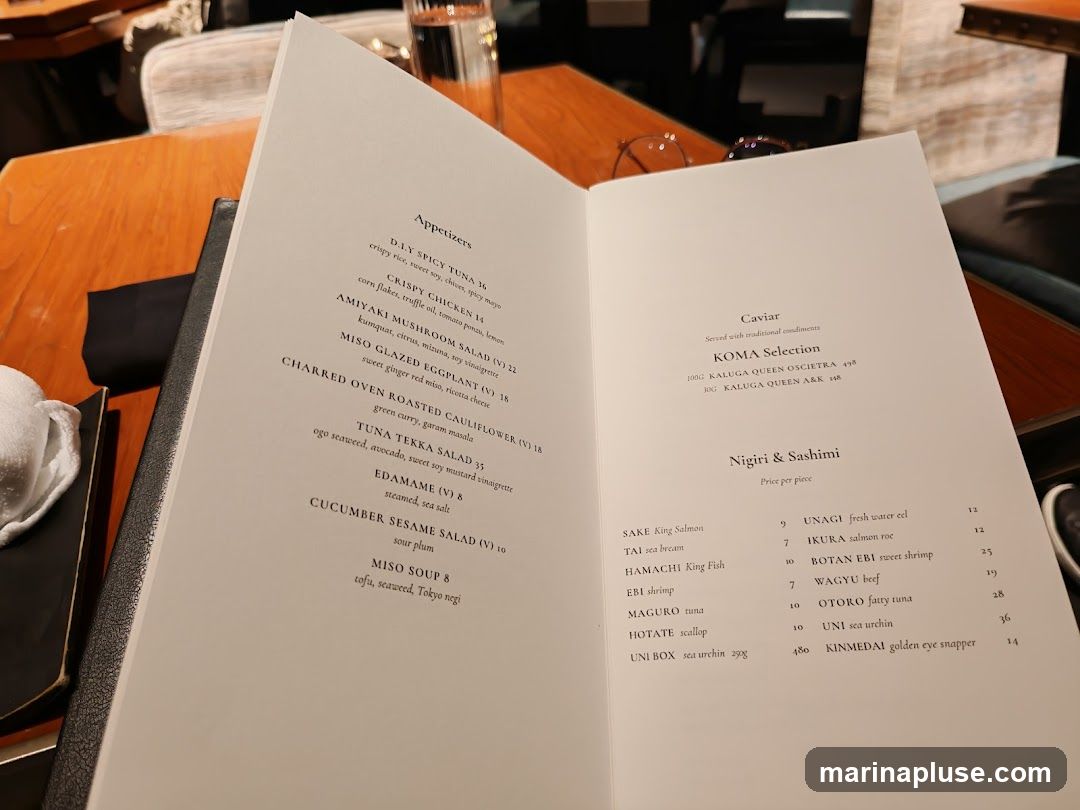 Menu featuring appetizers, caviar, and nigiri & sashimi.