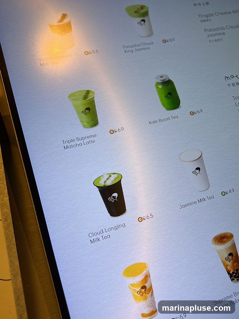 A digital menu displaying various drinks with images and prices.