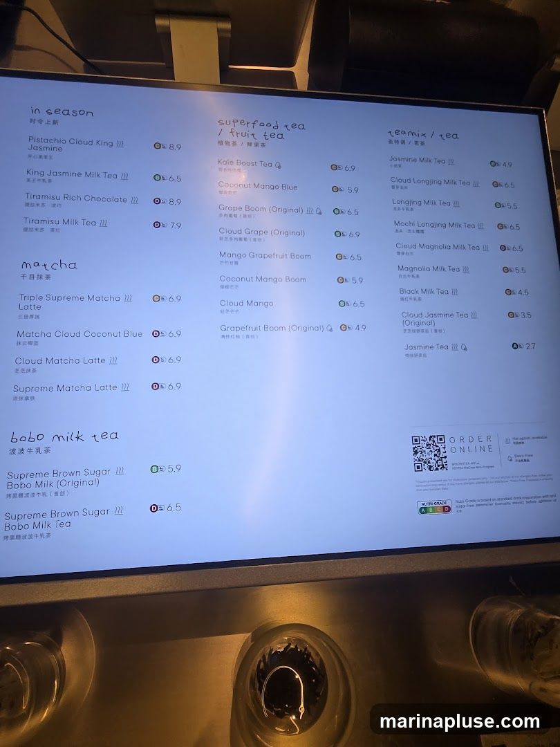 A digital menu displaying various tea and milk tea options.