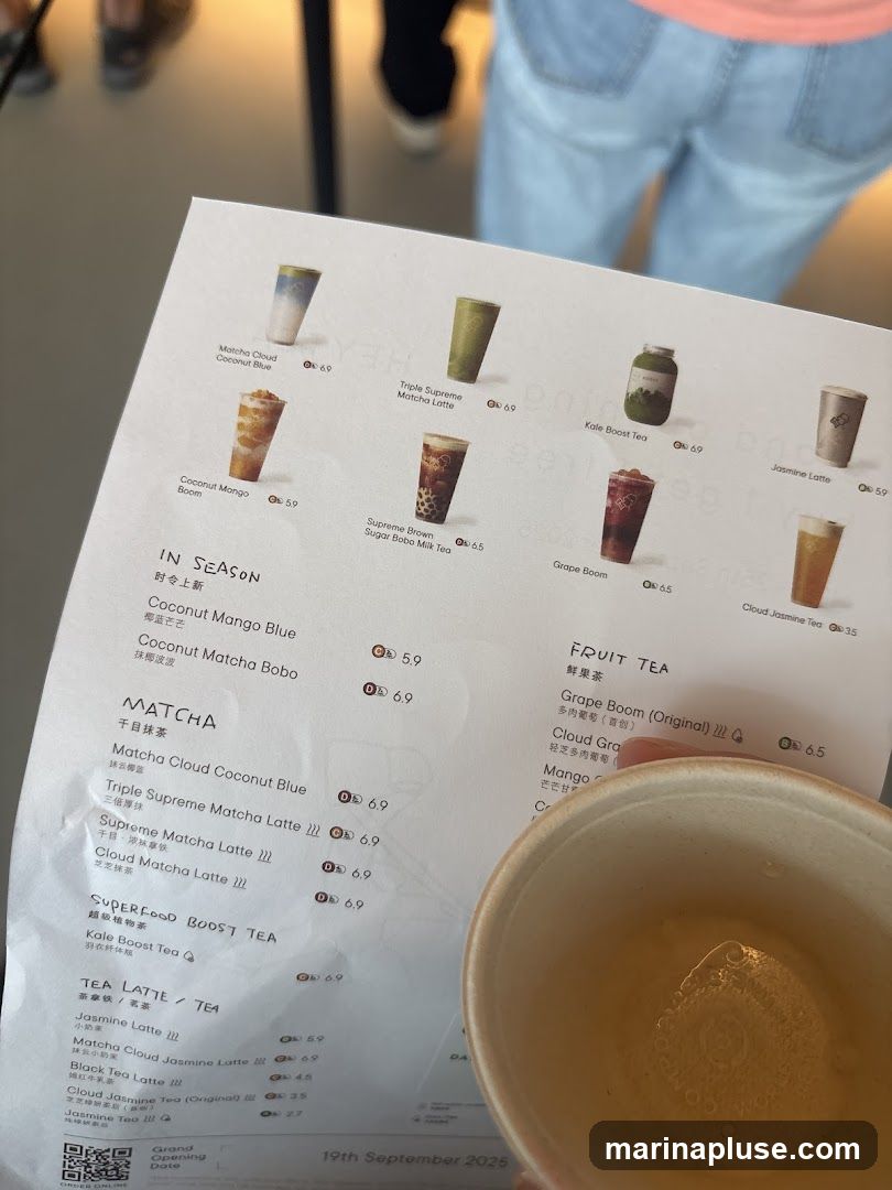 A menu with various tea and latte options, including seasonal specials, matcha drinks, superfood boosts, and fruit teas.