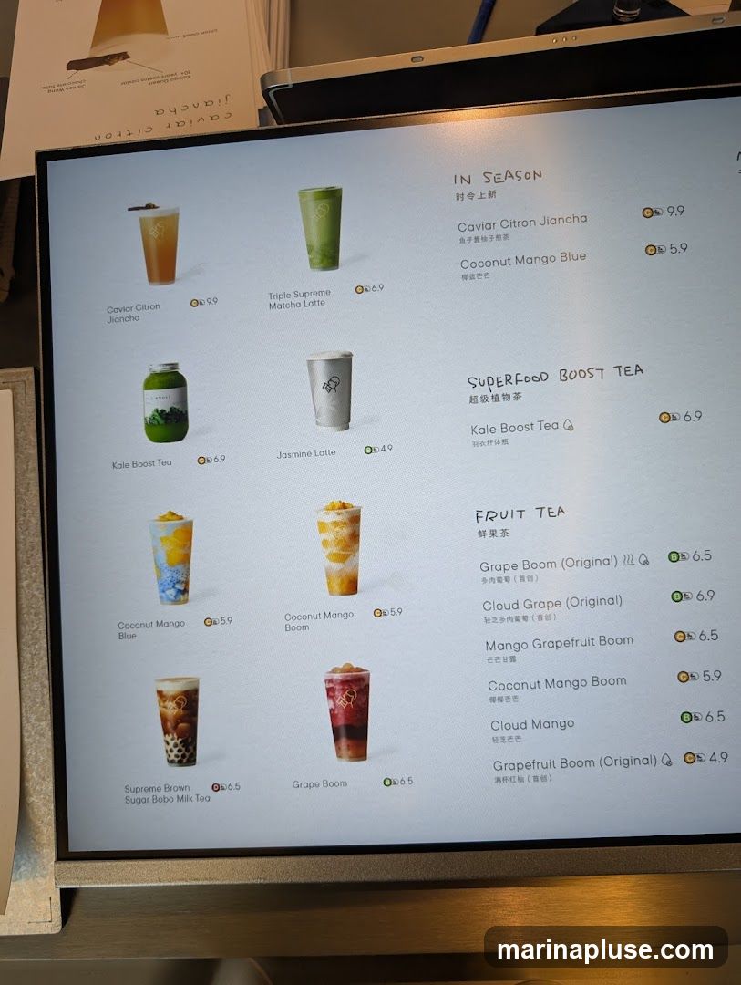 A digital menu displaying various drinks with images and prices.