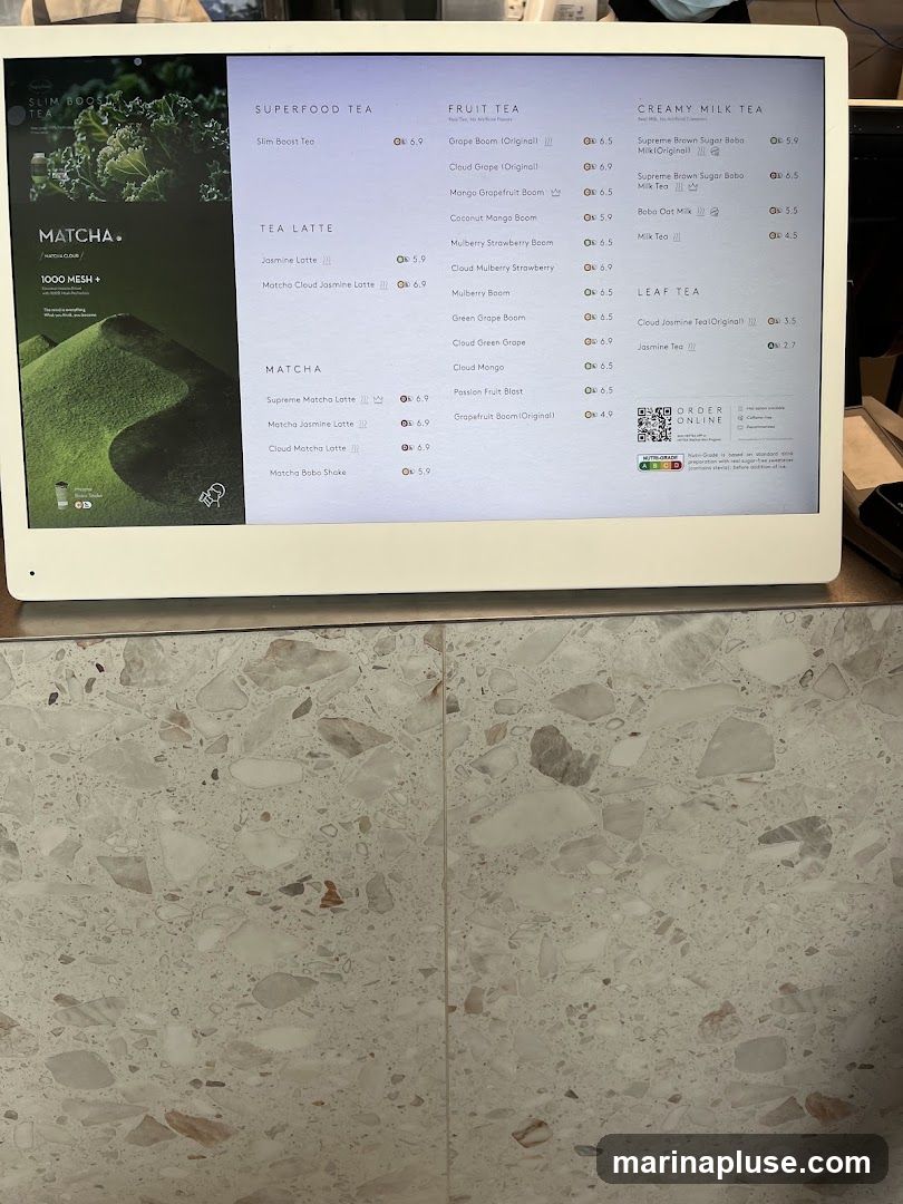 A digital menu displaying various tea options categorized into Superfood Tea, Fruit Tea, Creamy Milk Tea, Tea Latte, Matcha, and Leaf Tea.
