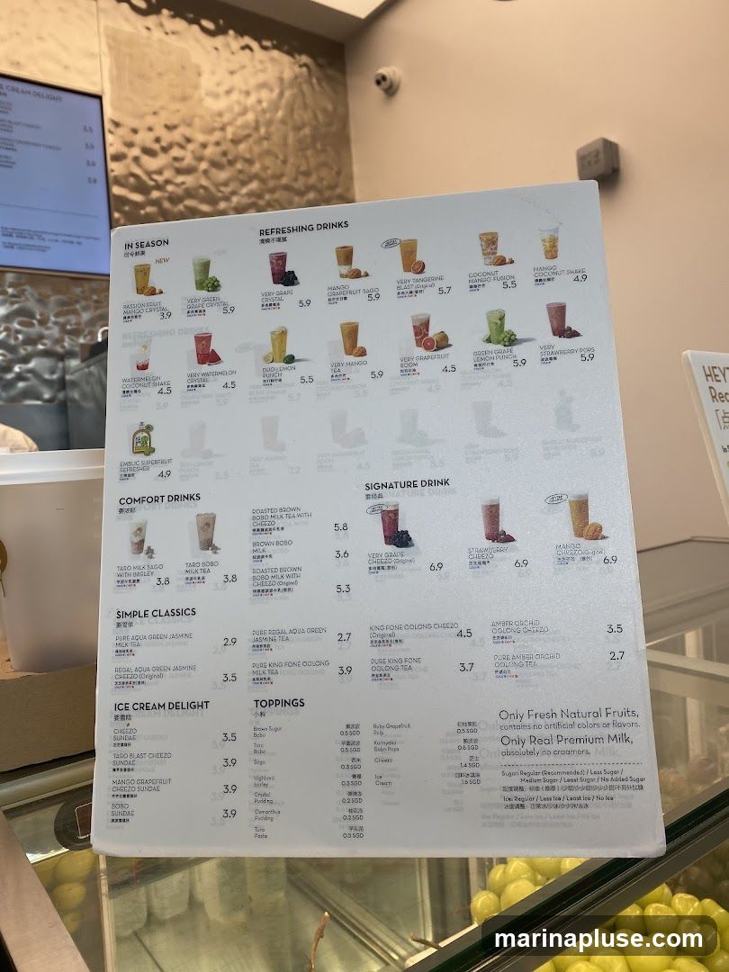 A menu board displaying various drinks, including refreshing drinks, comfort drinks, simple classics, and ice cream delights. It also lists toppings and sugar/ice level options.