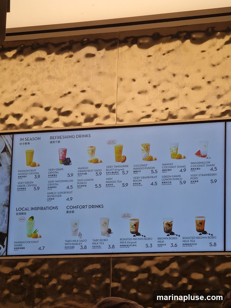 A menu board displaying various refreshing and comfort drinks, with images of the drinks and their prices.