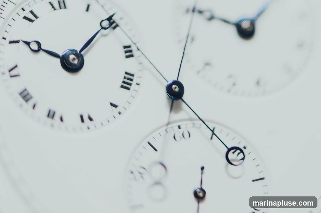 A close-up, abstract view of multiple watch faces, some with Roman numerals and others with Arabic numerals. The hands of the watches are visible, indicating different times. The overall impression is one of intricate detail and the passage of time.