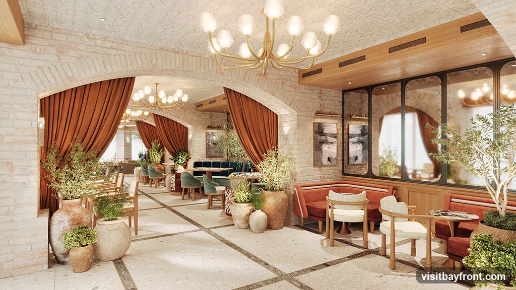 A well-lit and elegantly decorated restaurant interior with exposed brick walls, arched doorways draped with burnt orange curtains, and chandeliers. The seating includes plush booths and chairs in shades of green and rust, with wooden accents. Potted plants and large vases add a touch of greenery and texture to the space. Mirrored panels on one wall reflect the ambiance, creating a sense of depth.