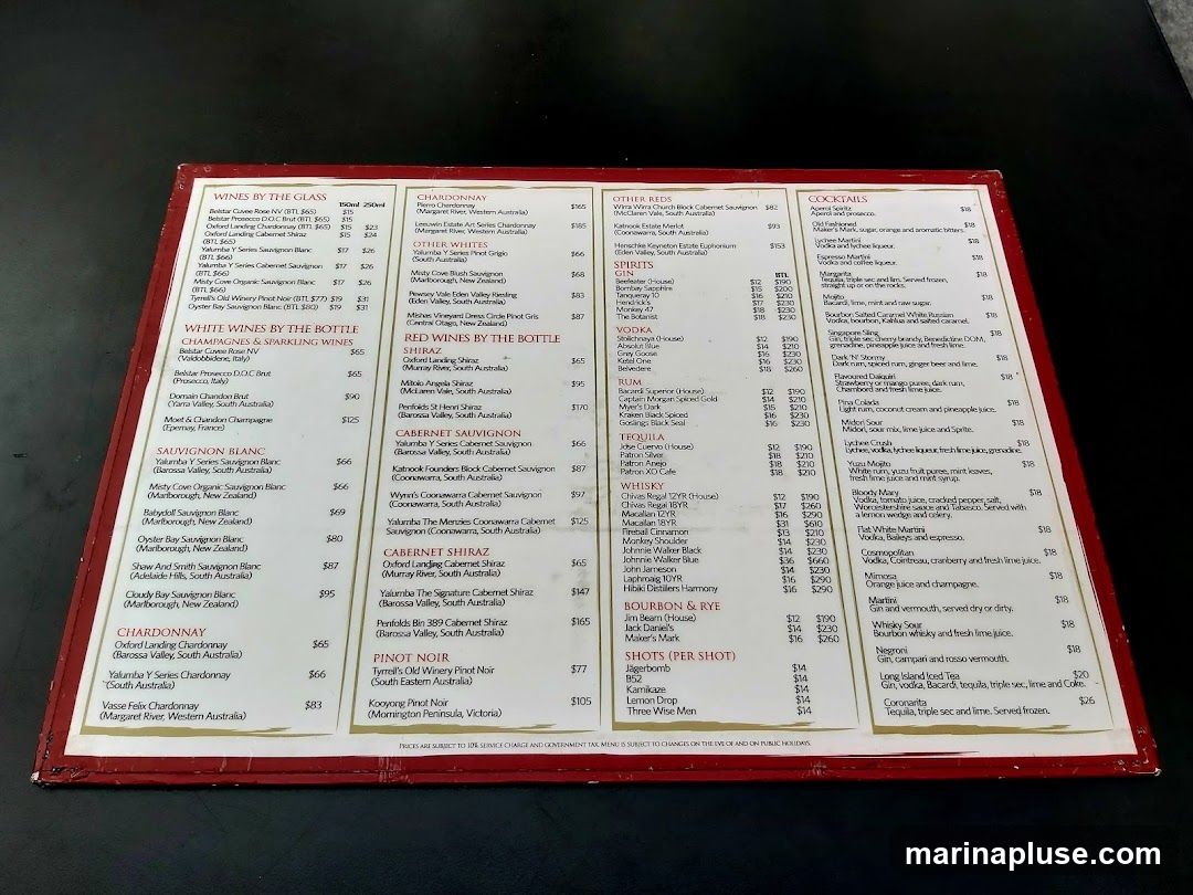 Wines by the glass and bottle, including Chardonnay, Sauvignon Blanc, Pinot Noir, and various other red and white wines. Also features a selection of cocktails, spirits, and shots.