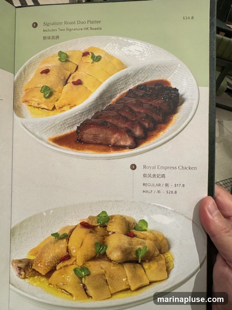 A menu page featuring two dishes: Signature Roast Duo Platter and Royal Empress Chicken.