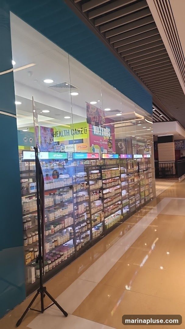 A view of the interior of a Watsons store, showcasing shelves stocked with health and beauty products. Prominent signage includes "HEALTH CARE" and "WATSONS". The store has a modern design with glass storefronts and a well-lit interior.