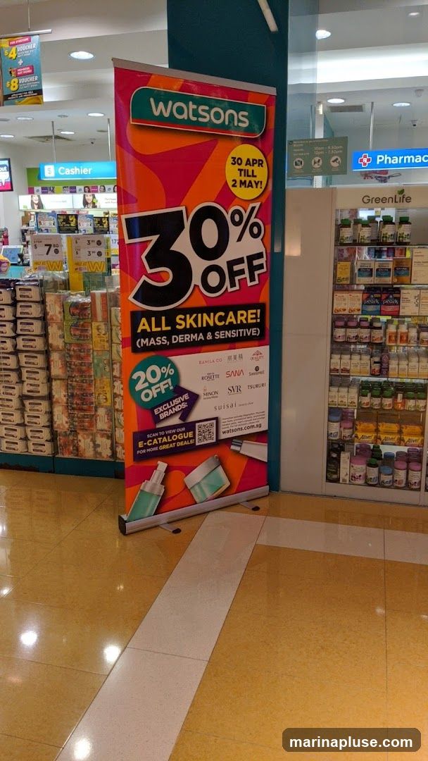 A promotional banner for Watsons advertising 30% off all skincare products, including mass, derma, and sensitive categories. The promotion runs from April 30th to May 2nd. It also highlights an additional 20% off exclusive brands. The banner features images of skincare bottles and jars, and a QR code to view an e-catalogue. In the background, shelves stocked with various health and beauty products are visible, along with a cashier counter and pharmacy signage.