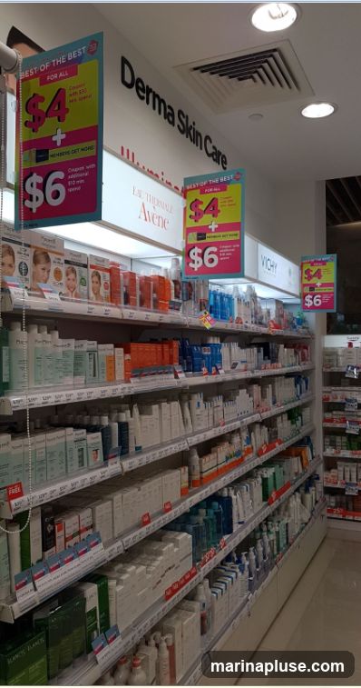Shelves stocked with various skincare products from brands like Avene and Vichy. Promotional signs indicate "Best of the Best" deals with prices of $4 and $6.