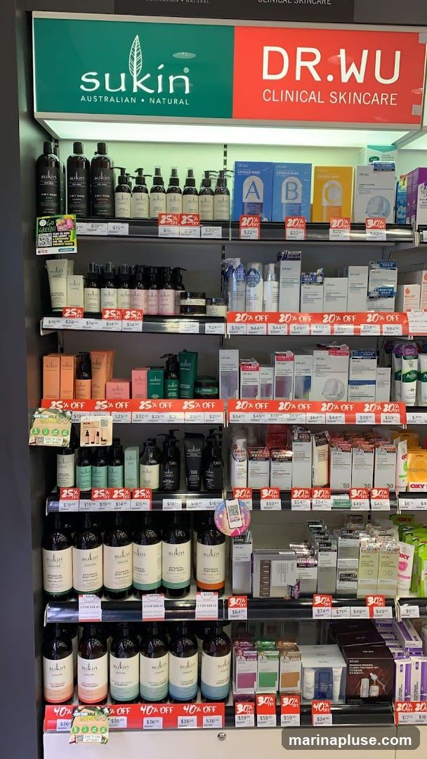 A retail display featuring skincare products from the brands Sukin and Dr. Wu. The shelves are stocked with various bottles, jars, and boxes of cleansers, moisturizers, serums, and other personal care items. Many products have discount tags indicating 20%, 25%, 30%, and 40% off.